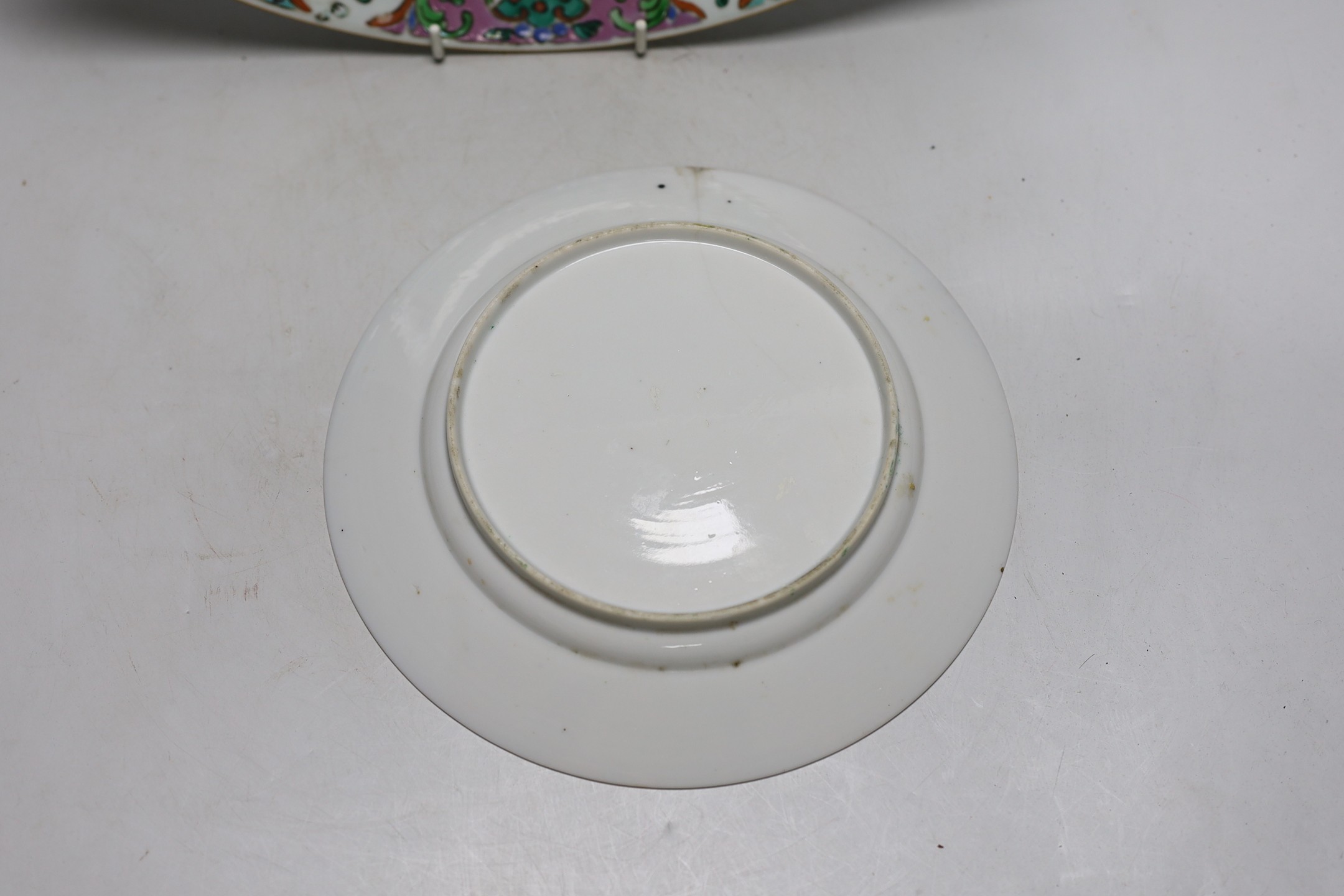 An 18th century Chinese famille rose charger and a Canton plate, charger 36cms